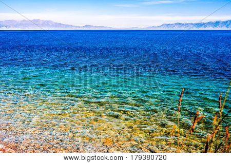 Beautiful Sailimu Lake in Xinjiang, China it's a fault basin at an elevation of 2,073 meters, the highest among the Xinjiang high mountain lakes and with a maximum depth of 86 meters.