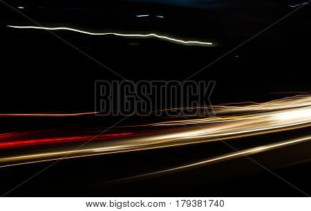 Car lights trace in the street at nigth
