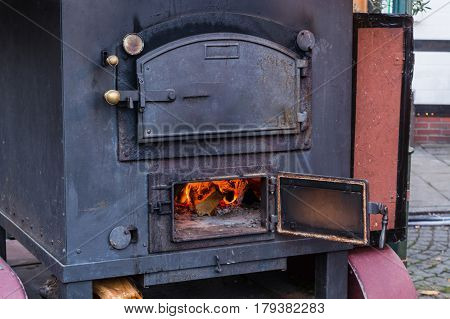 Mobile metal kitchen stove for cooking food outdoors