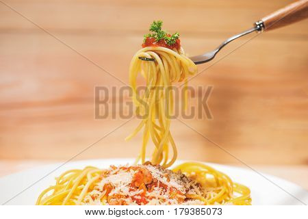 Close-up Of Asta Spaghetti With Tomato Sauce, Olives And Garnish. Italian Food.