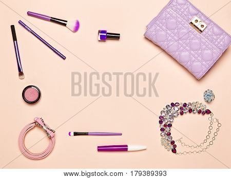 Fashion lady accessories set. Falt Lay. Stylish handbag. Make-Up brushes. Jewelry and nail polish. Women accessories