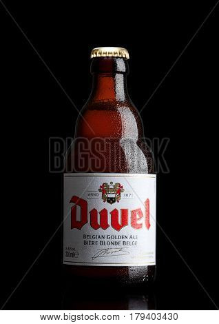 London,uk - March 30, 2017 :  Bottle Of Duvel Beer On Black. Duvel Is A Strong Golden Ale Produced B