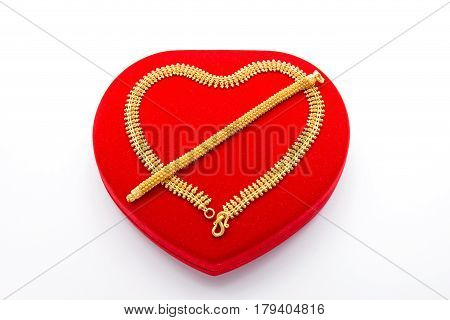 Ornament Golden Necklace and Bracelet on Red Heart Box