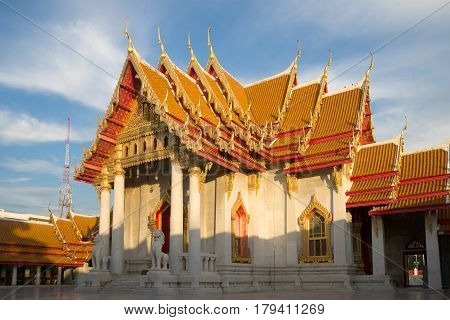 BANGKOK, THAILAND - DECEMBER 12, 2016: Vihan Buddhist temple of Wat Benchamabophit (Marble Temple) on a sunny evening. View from the courtyard. Bangkok, Thailand