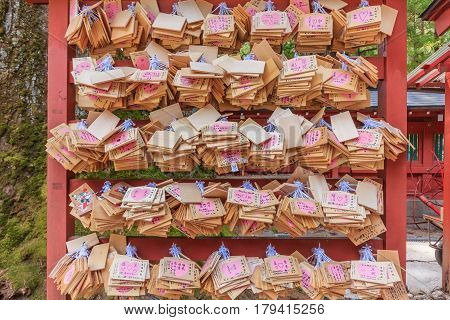 NIKKO JAPAN - APRIL 16 2014: Ema(Wooden prayer tablets) at at Futarasan Jinja Chugushi Shrine in Nikko Tochigi Japan. Ema are small wooden plaques used for wishes by shinto believers
