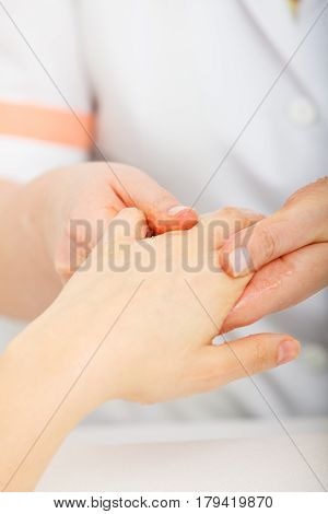 Woman Getting Hand Massage At Beauty Salon