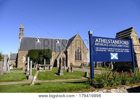 ATHELSTANEFORD EAST LOTHIAN SCOTLAND - 20 APRIL 2016 - Beautiful old stone church home of National Flag Heritage Centre in the pretty village of Athelstaneford East Lothian Scotland. Said to be the birthplace of Scotland's national flag St Andrew's Cross