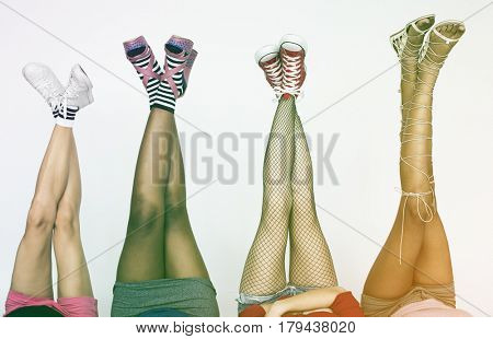 Woman laying back down and putting legs up high