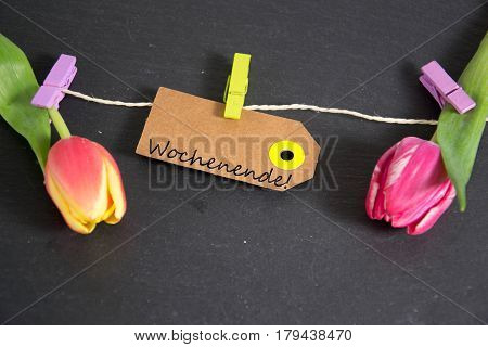 Wochenende - german for  weekend - written on a paper tag