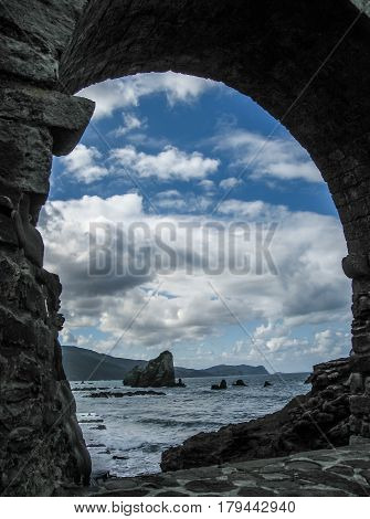 Gastelugache - island on coast of Bay of Biscay belonging to municipality of Bermeo Basque Country. Island is connected to mainland by man-made bridge that goes into winding staircase that spans 237 degrees.