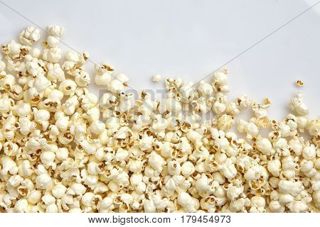 Tasty salted popcorn isolated on white background