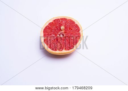 Half A Fresh Red Grapefruit On White Background