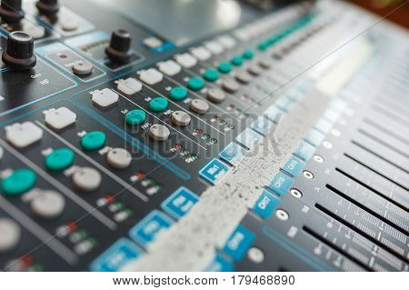 Music equipment closeup. Management console sound design at the event. Big black mixer with control knobs.