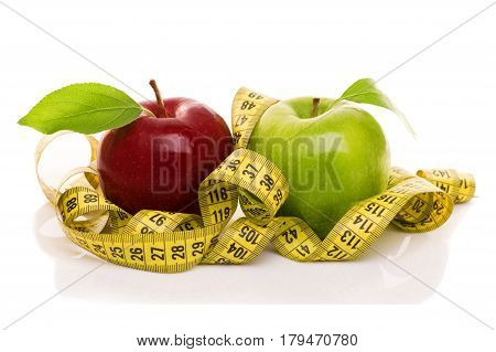 red and green apples with measuring tape Isolated on white background
