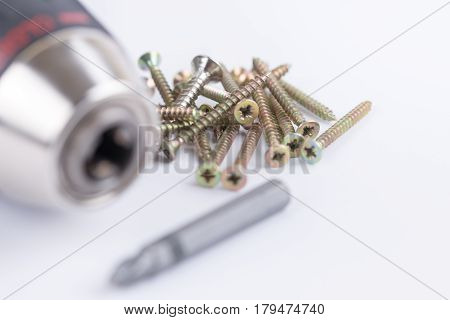 Head Of Acu Drill On The White Background With Screws