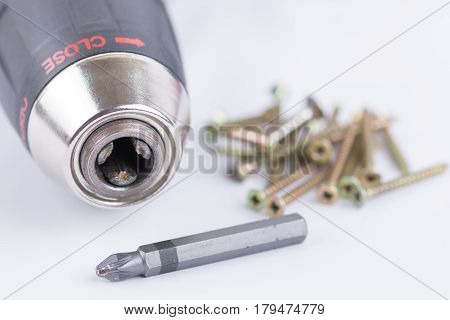 Head Of Acu Drill On The White Background With Screws
