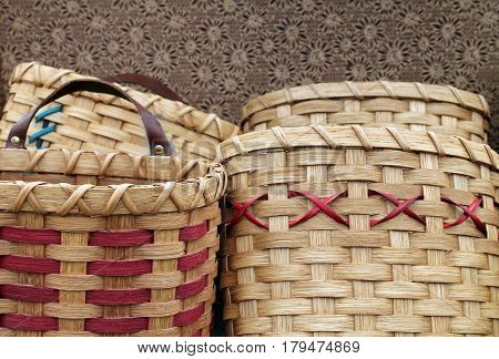 Several Handwoven Tan and Red Wooden Baskets