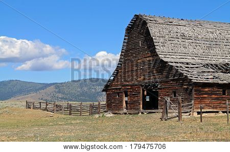 Rustic Barn with Dilapidated Roof in Sagebrush Country