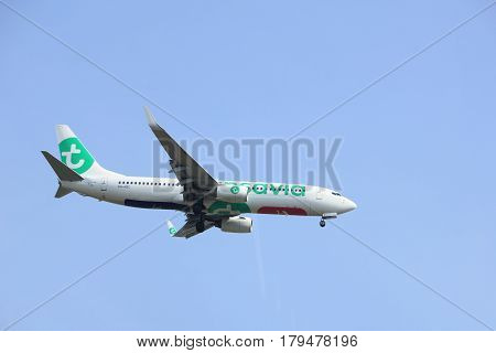 Amsterdam the Netherlands - March 31st 2017: PH-HSC Transavia Boeing 737-800 approaching Polderbaan runway at Schiphol Amsterdam Airport the Netherlands