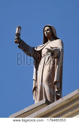 SHKODER, ALBANIA - SEPTEMBER 30: Saint Clare of Assisi statue on St Stephen's Cathedral in Shkoder, Albania on September 30, 2016.