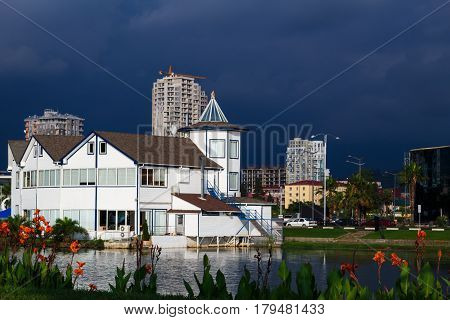 Approacing thunderstorm with dark blue clouds in the sky in Batumi Batum Georgia with bright vivid foreground