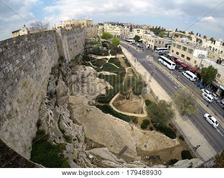 JERUSALEM ISRAEL - MARCH 25 2017: Northern wall of the old city of Jerusalem and Sultan Suleiman street