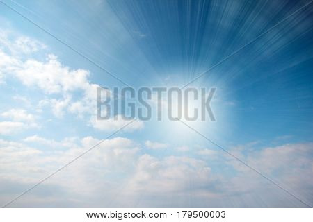 Sunny bright piercing rays and streams of light on a cloudy sky