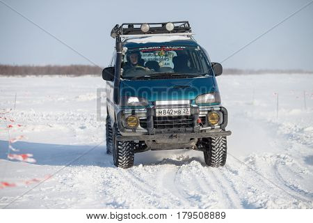 KHABAROVSK RUSSIA - JANUARY 28 2017: Mitsubishi Delica riding on snow during local championship
