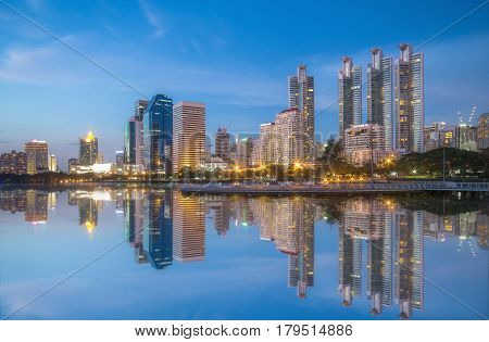 Panorama picture Bangkok downtown skyscrapers on Twilight Time View from park