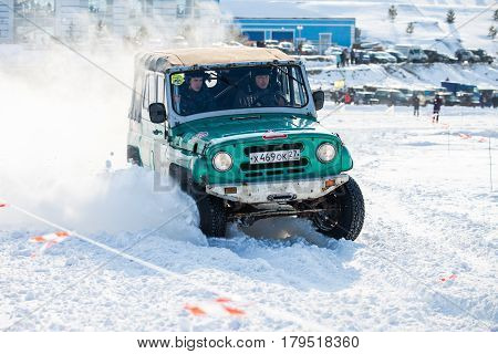 KHABAROVSK RUSSIA - JANUARY 28 2017: UAZ 469 riding on snow during local championship