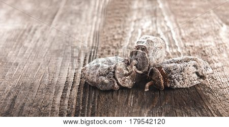Dried persimmon fruits on wooden background. Oriental sweets