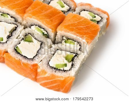 close up view of roll with avocado, cucmber and salmon. Isolated on white with clipping path. Copy space.