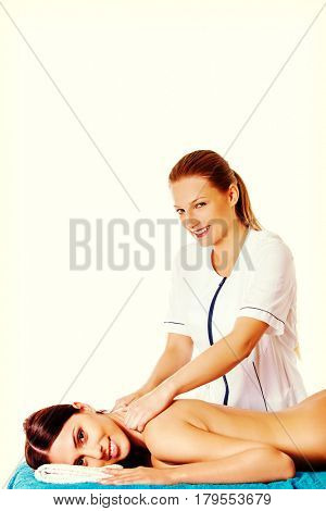 Woman having massage of body in the spa salon. Beauty treatment concept.
