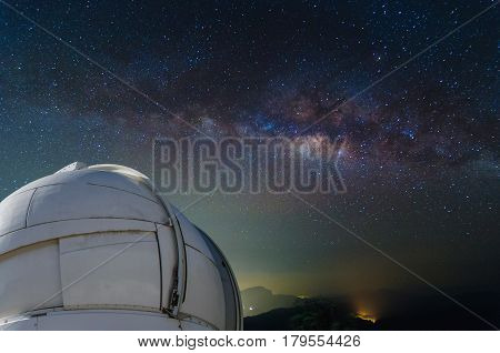 observatory with milky way galaxy long exposure photograph with grain.Image contain certain grain or noise and soft focus. color tone effect astronomy concept.