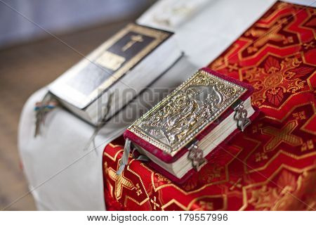 the holy christian bible on a table of the priest close up. concept of faith in god, preparation for a baptism in church. Christianity concept.