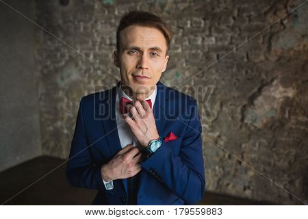 young businessman in blue suit emotional posing
