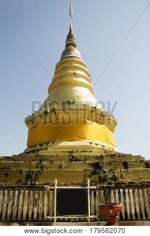 Gloden chedi for people respect praying and visit at Wat Phra that chom ping Temple on December 27 2016 in Lampang Thailand.