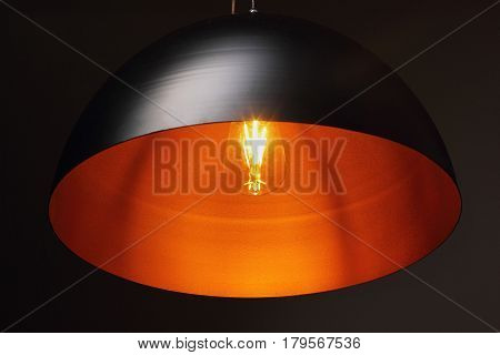 Lamp Shade From Modern Black Metal Lamp Hanging On Black Wall Warm Light