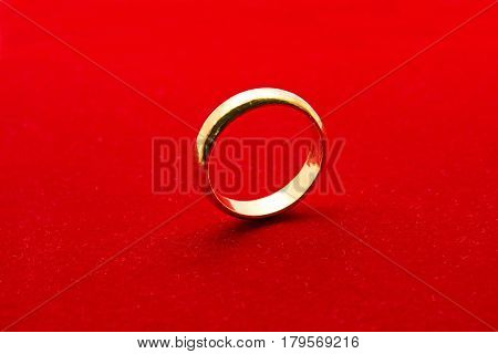 Jewelry Golden Ring Isolated on Red Background