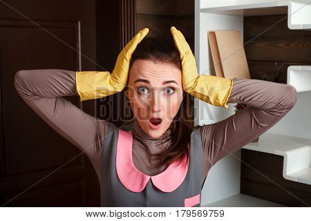 Cleaning servisce worker in uniform and gloves