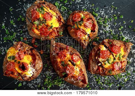 hot baked sweet potato stuffed with bacon, cheddar cheese, cherry tomatoes, balsamic vinegar, cress salad and parmesan sprinkle. Tacco, burrito style