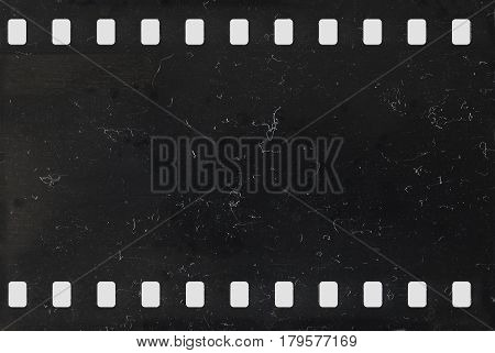 Strip of old celluloid film with dust and scratches - negative