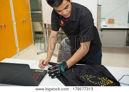 Bangkok, Thailand - November 17, 2015 : 
King Mongkut's Institute of Technology Ladkrabang is a research and educational institution in Thailand.
A class of high school students study electronics and robotics.
