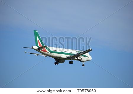 Amsterdam the Netherlands - July 15th 2016:EI-DSB Alitalia Airbus A320 approaching Polderbaan runway at Schiphol Amsterdam Airport arriving from Rome Italy