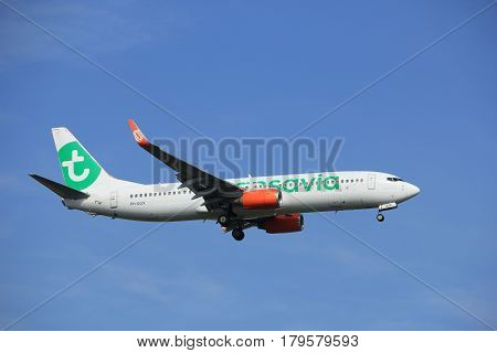 Amsterdam the Netherlands - July 21st 2016: PH-GGX Transavia Boeing 737 approaching Polderbaan runway at Schiphol Amsterdam Airport arriving from Barcelona Spain