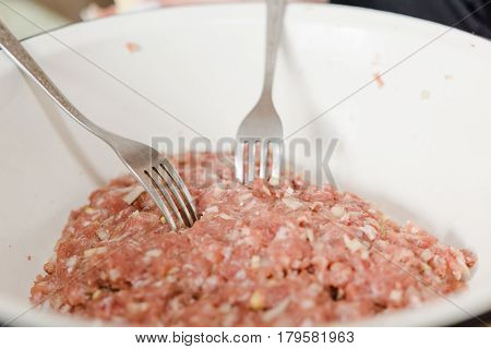 Fresh Meat Is Overwound On Forcemeat.
