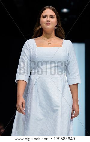 MOSCOW RUSSIA - MARCH 21 2017: Model walk runway for FABERLIC by VALENTIN YUDASHKIN catwalk at Autumn-Winter 2017-2018 Moscow Fashion Week. Plus-size fashion models.