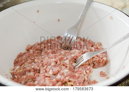 Fresh Meat Is Overwound On Forcemeat.