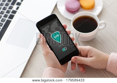 woman holding phone with app vpn creation Internet protocols for protection private network