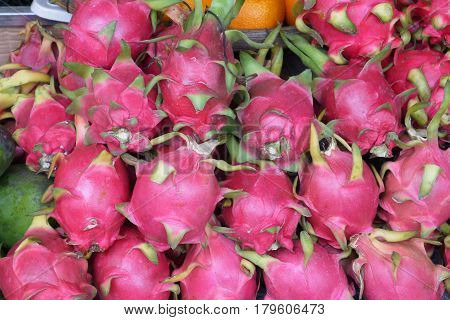 Fruit with a peel of brightly pink or red color, smooth with leaf outgrowths.
